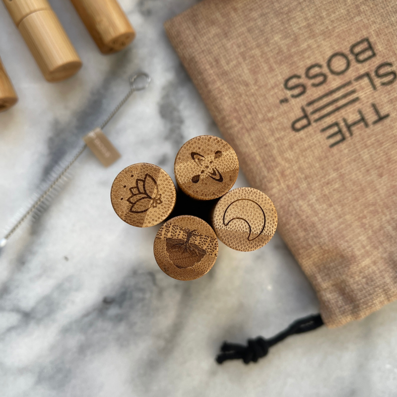 Top of the essential oil roller set showing engraved icons for sleep, meditation, mindfulness and resilience blends.