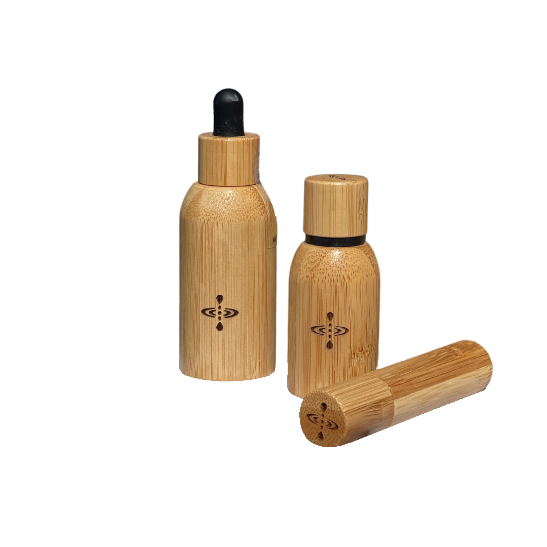 Meditation Oil refill in bamboo bottle with dried rose around it