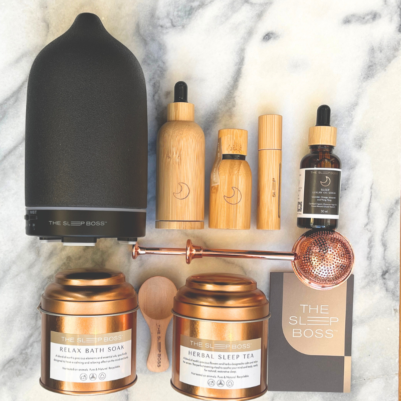 A collection of the Glow Luxe Set products displyed on a marble table