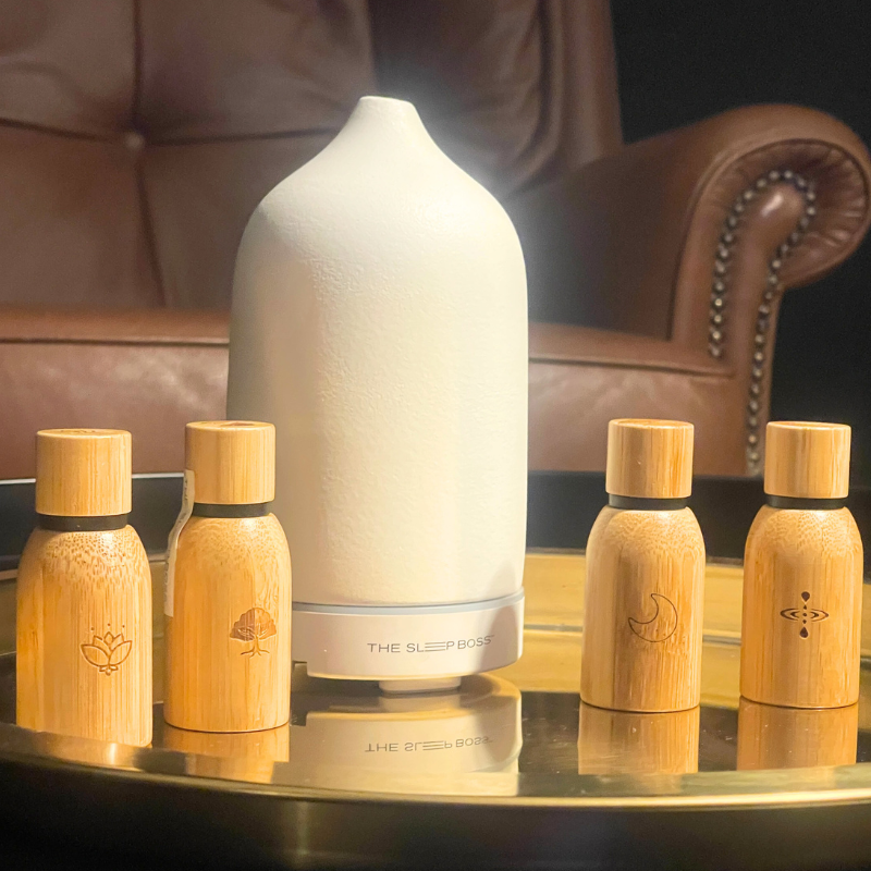 Pure Essential Oils Bundle Set with white diffuser in lounge setting